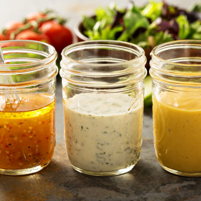 Salad dressing in jars.